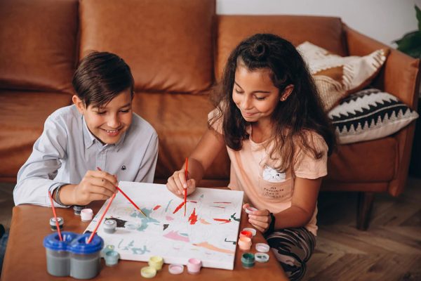 Brother and sister are painting